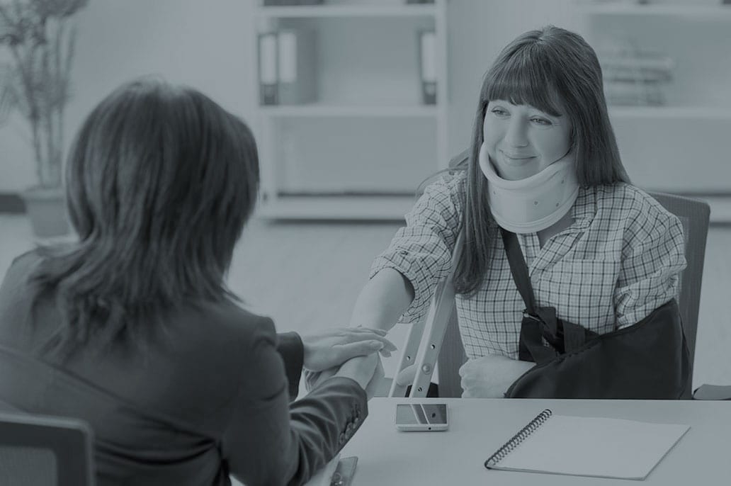 injured woman talking to a solicitor