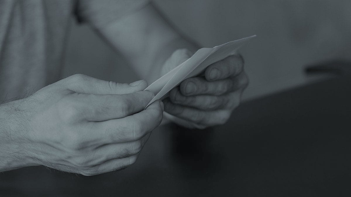 man opening legal letter