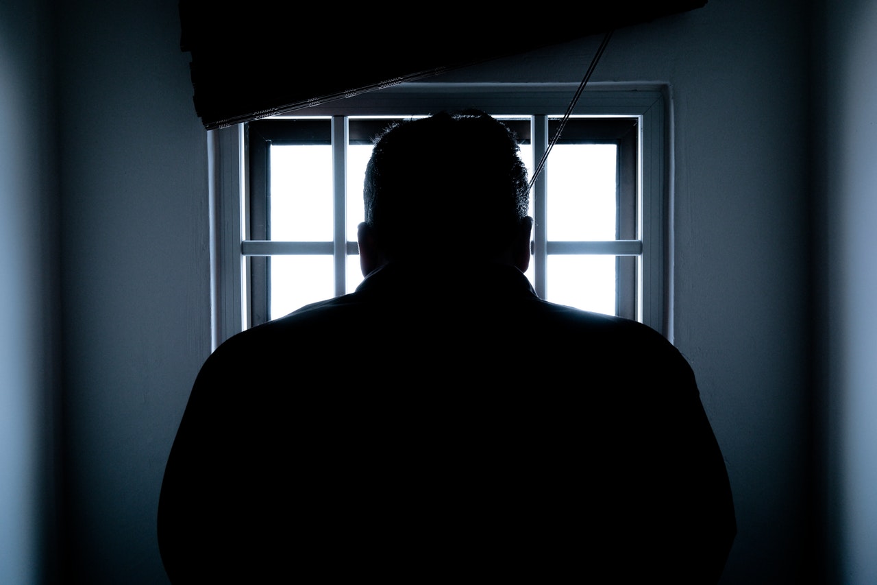 silhouette of a man in window