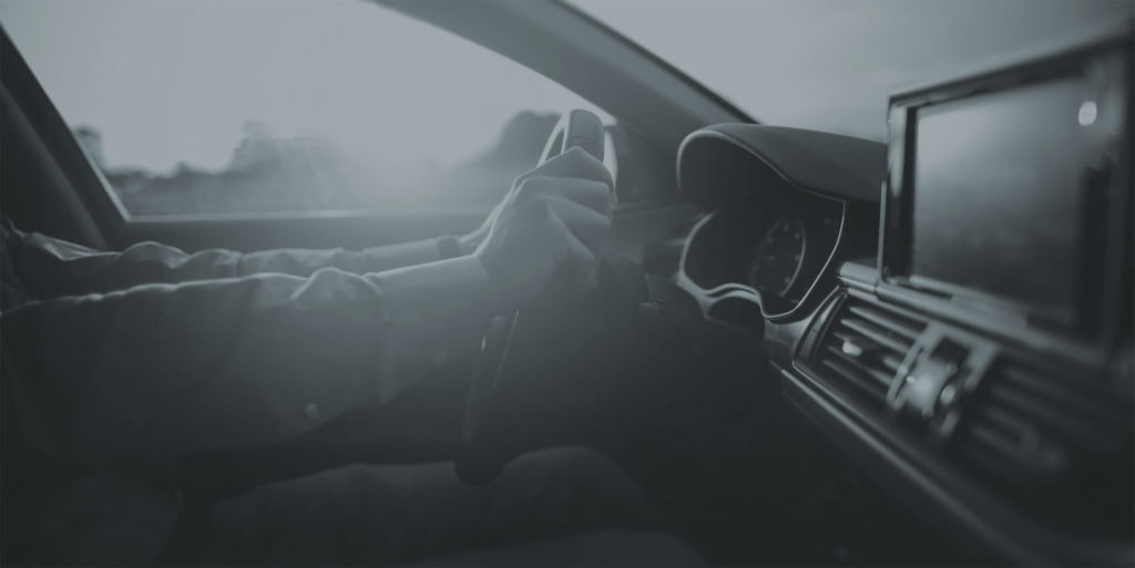 man driving car