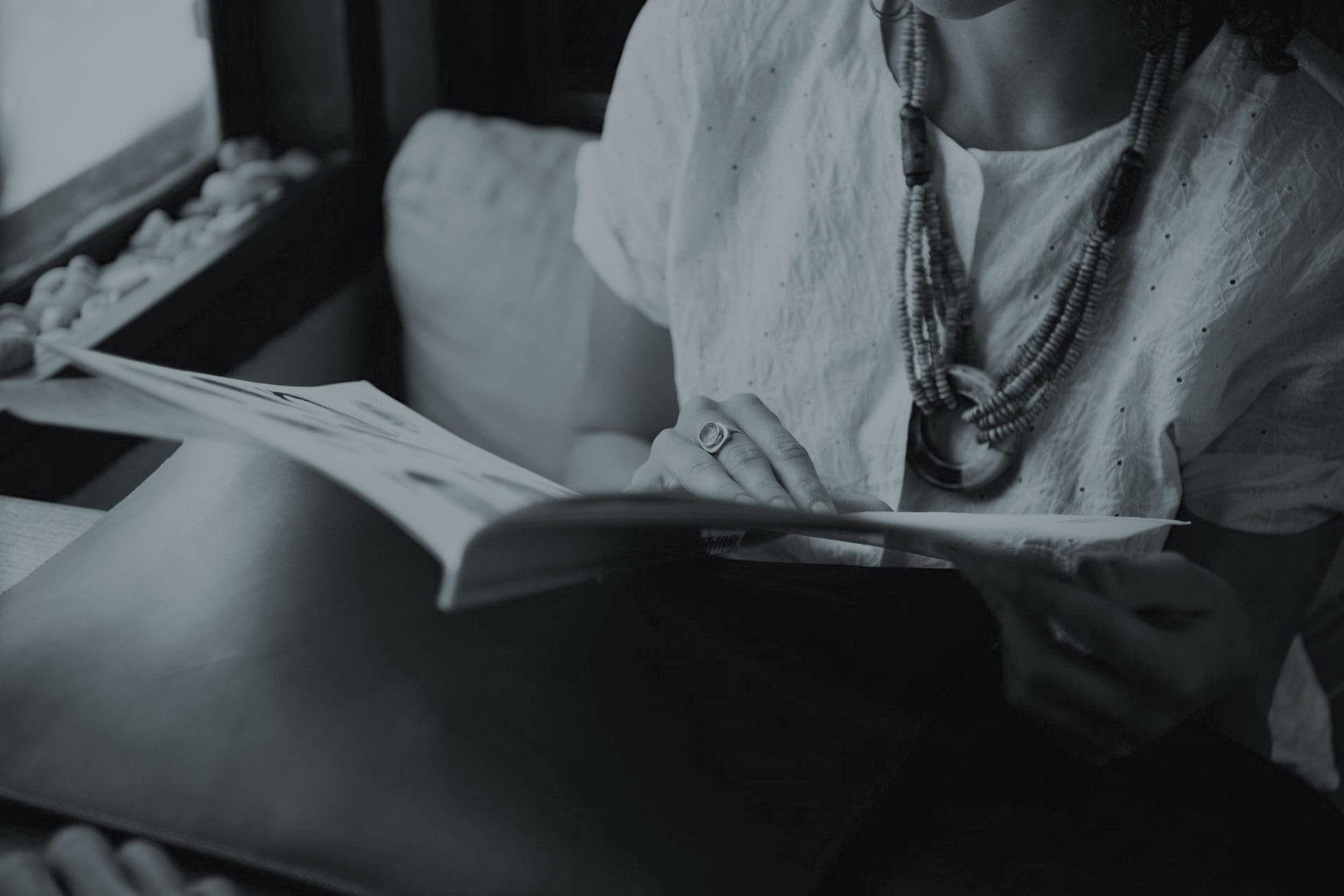 woman reading legal brochure