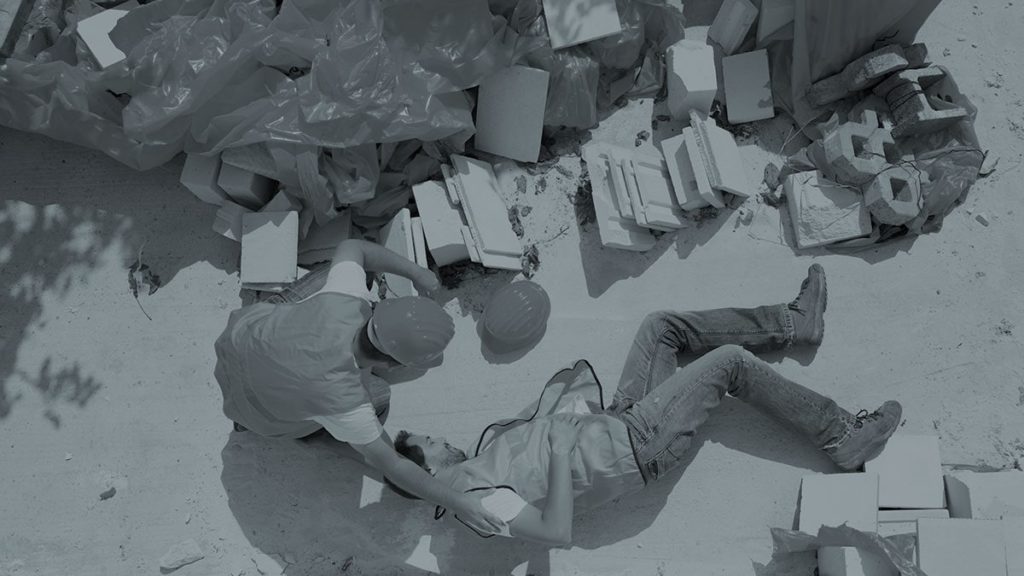 man on ground after fall at work