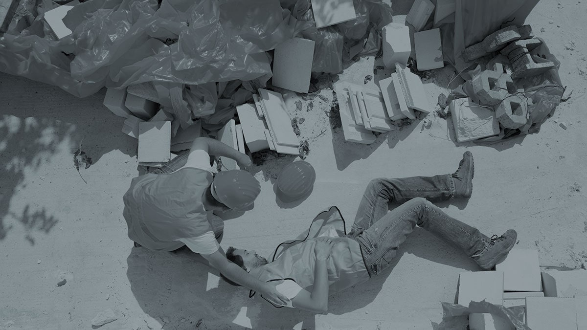 man on ground after fall at work